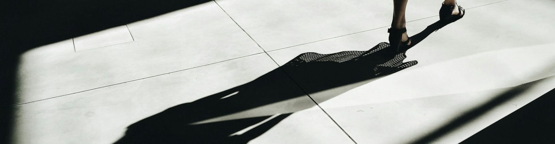 woman walking with shadow